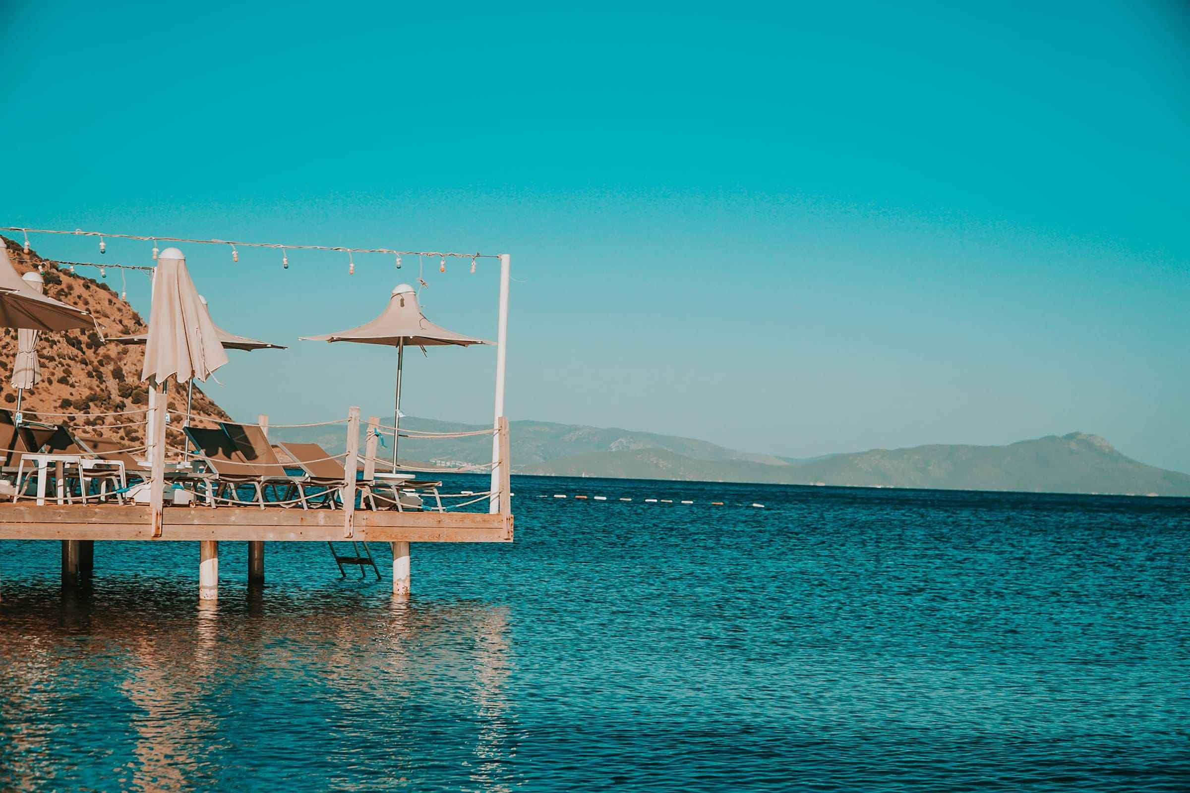 A wooden jetty over turquoise water