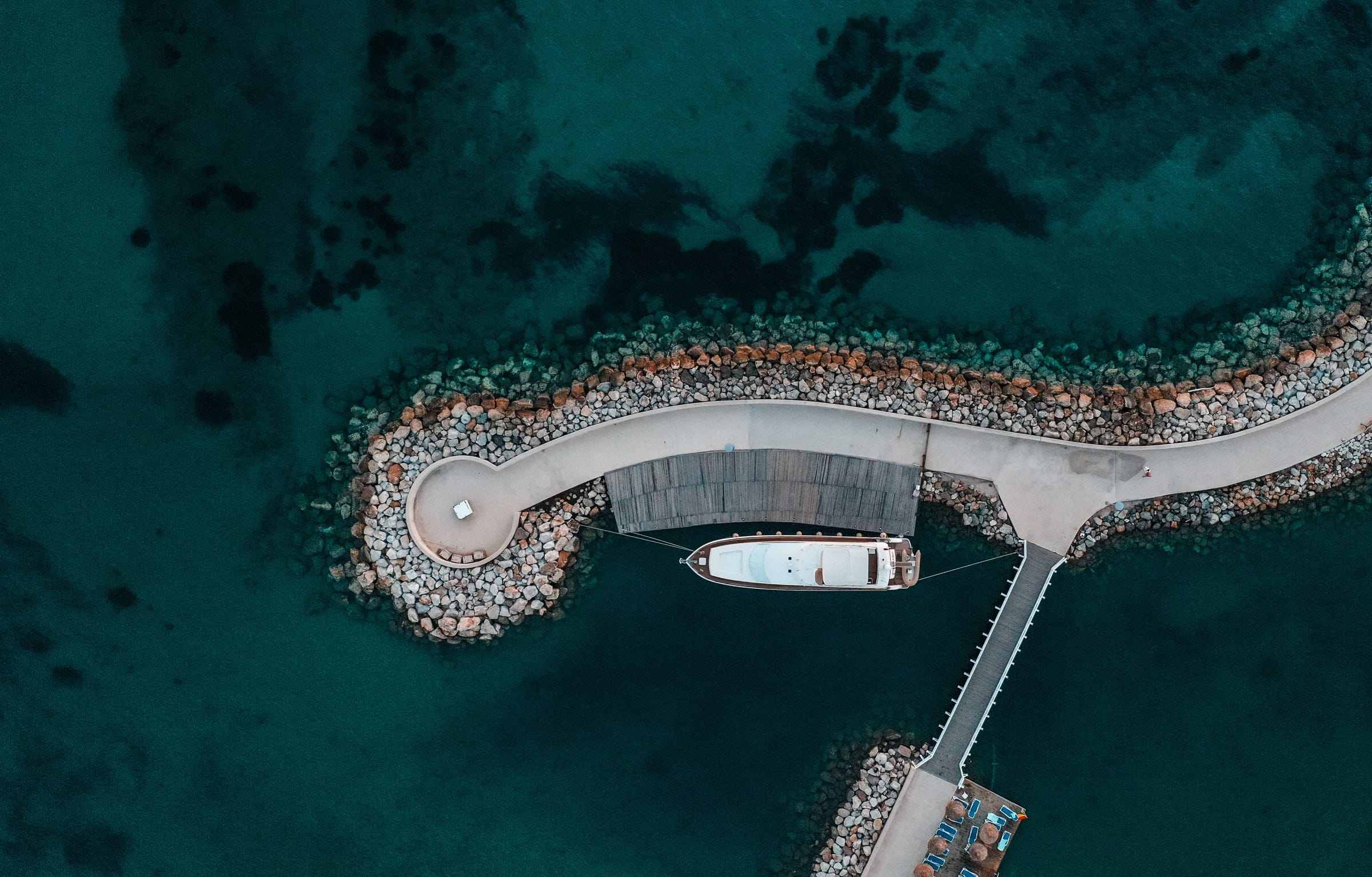 Aerial view of a marina and its breakwater