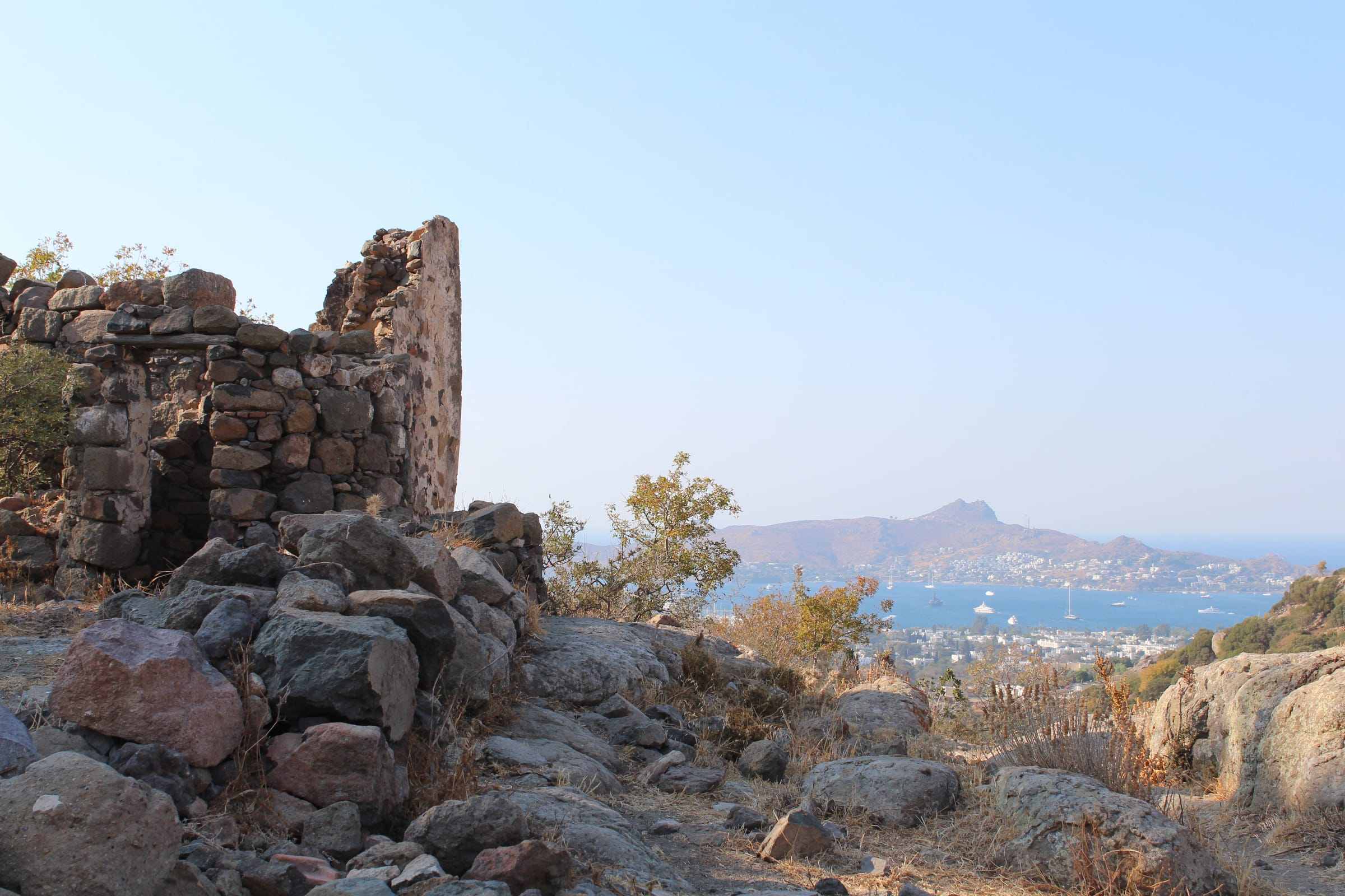 Stone ruins with a bay view behind